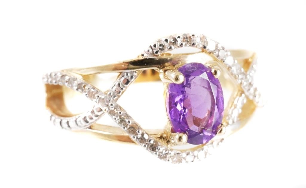 Appraisal: K yellow gold ring contains one oval mixed cut amethyst