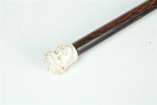 Appraisal: CANE American nd half- th century Ivory carved handle in