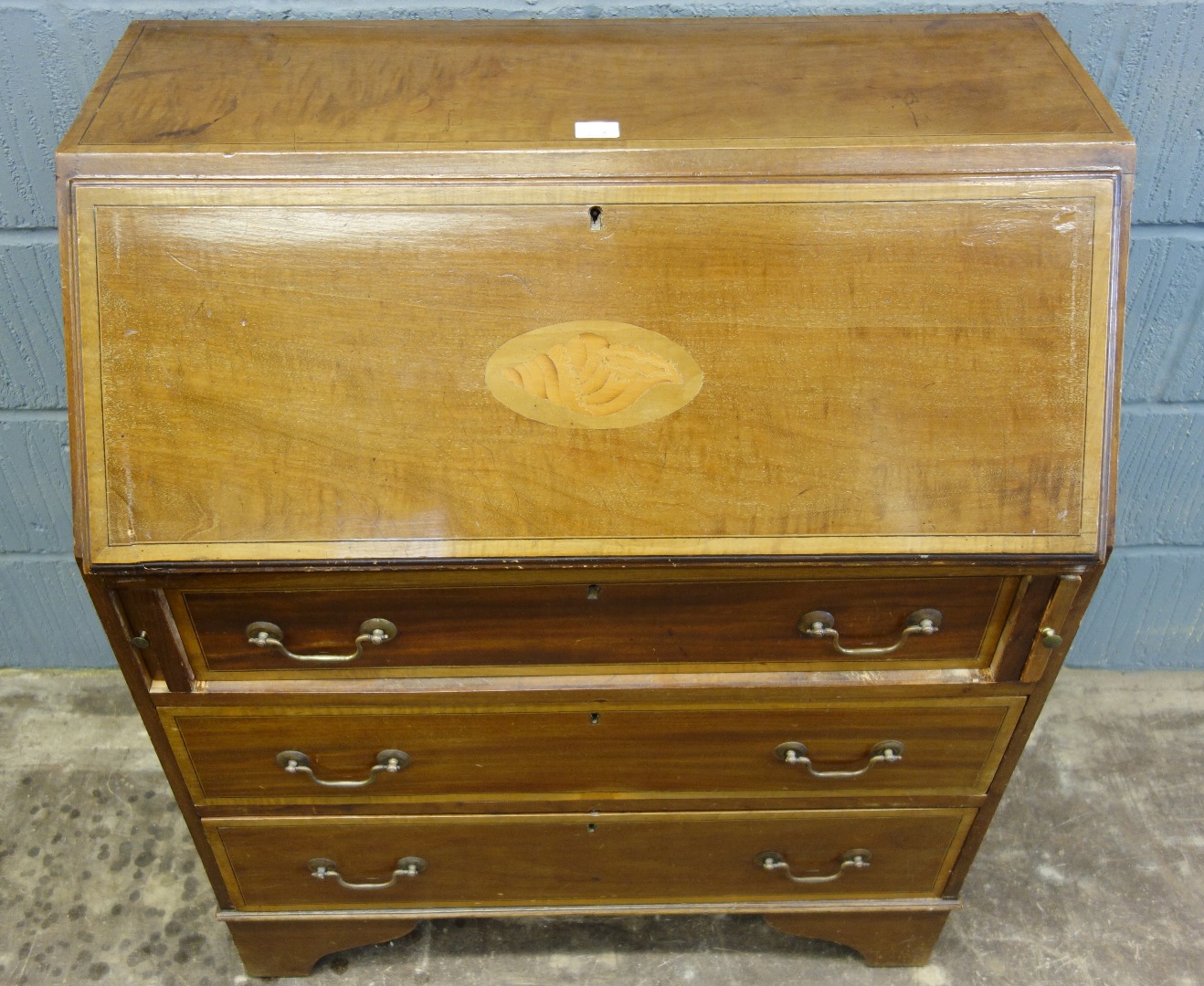 Appraisal: An Edwardian mahogany satinwood crossbanded and inlaid bureau with three