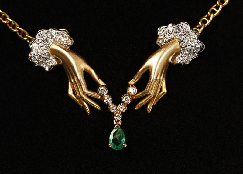 Appraisal: A diamond and emerald hands pendant necklace Carrera Y Carrera