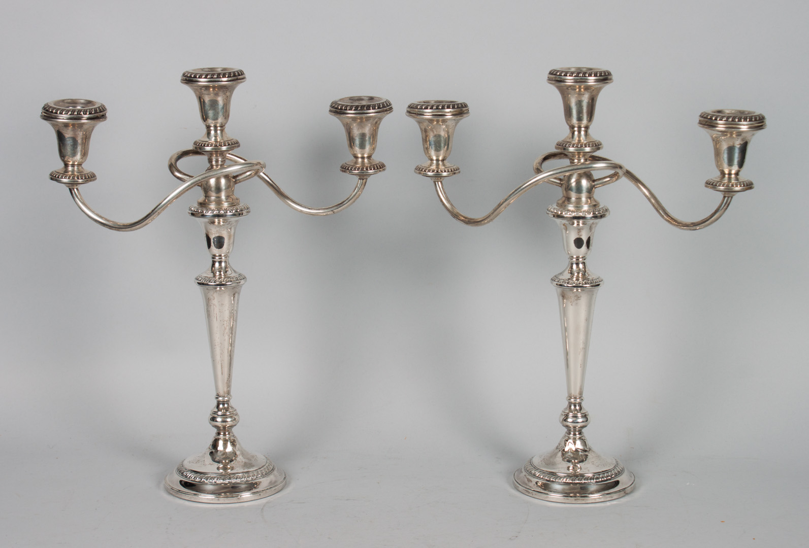 Appraisal: Pair of American weighted silver candelabra in H Condition Twists