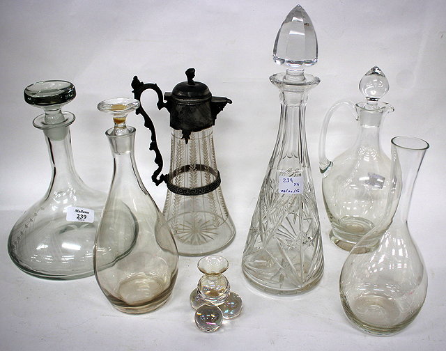 Appraisal: A GLASS SHIP'S DECANTER and stopper of typical form engraved