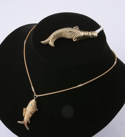 Appraisal: th century modeled as an articulated fish with chain together