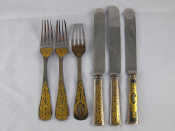 Appraisal: Three pairs of Swedish gilt-inlaid steel table knives and table