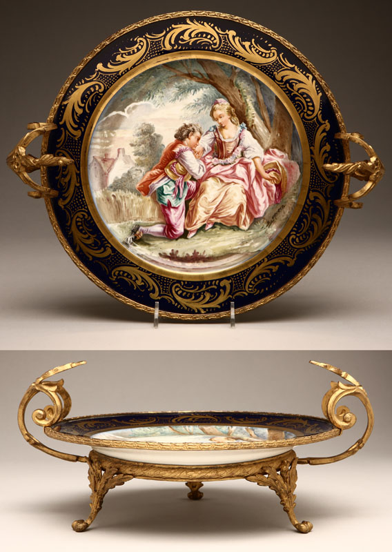 Appraisal: A Sevres style gilt-bronze-mounted porcelain centerpiece With blue interlaced ''L''