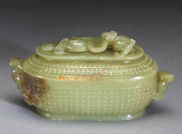 Appraisal: A yellow jade oval covered box Thinly sectioned and carved