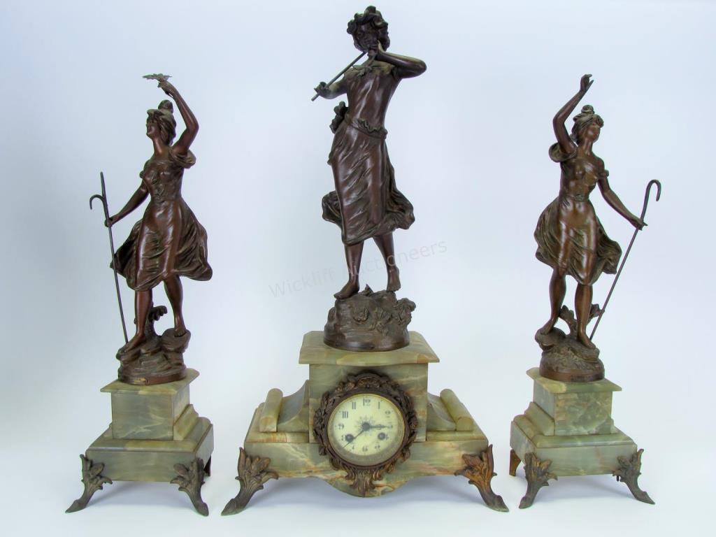 Appraisal: Figural Spelter Clock and Garniture Set green marble clock body