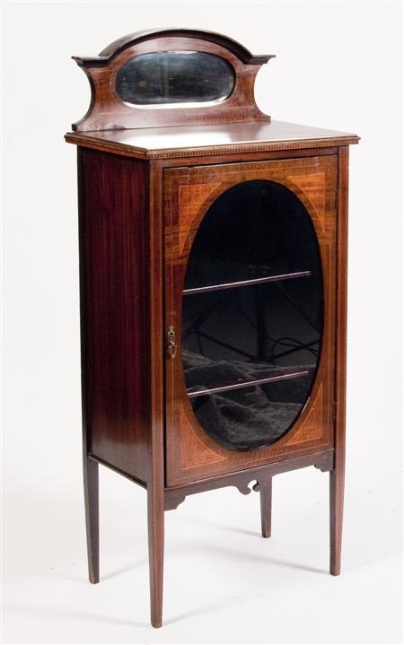 Appraisal: An Edwardian mahogany display cabinet the arched mirrored back gallery