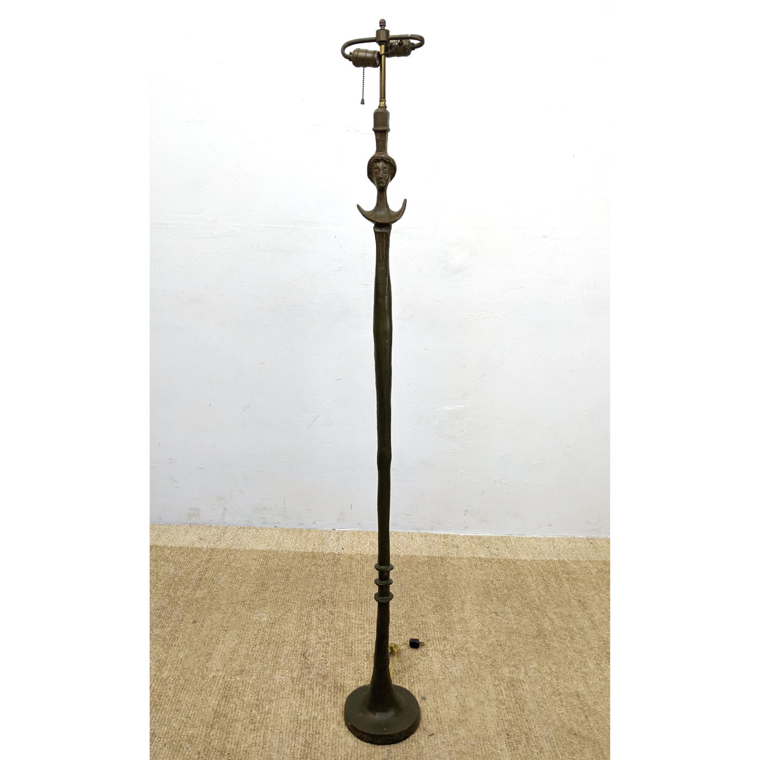 Appraisal: AFTER ALBERTO GIACOMETTI Bronze Floor lamp 'Tete de Femme' Brown