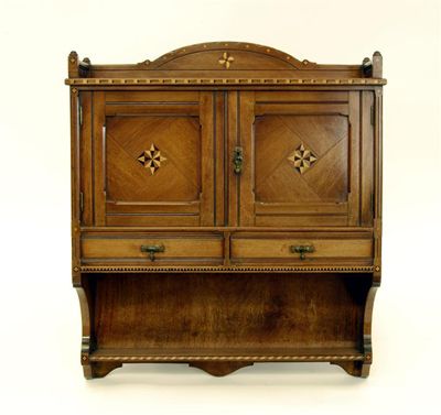 Appraisal: A Gothic Revival walnut wall cabinet the design attributed to