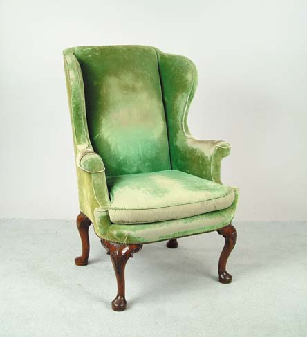 Appraisal: QUEEN ANNE CARVED WALNUT WING ARMCHAIR With raked rectangular back