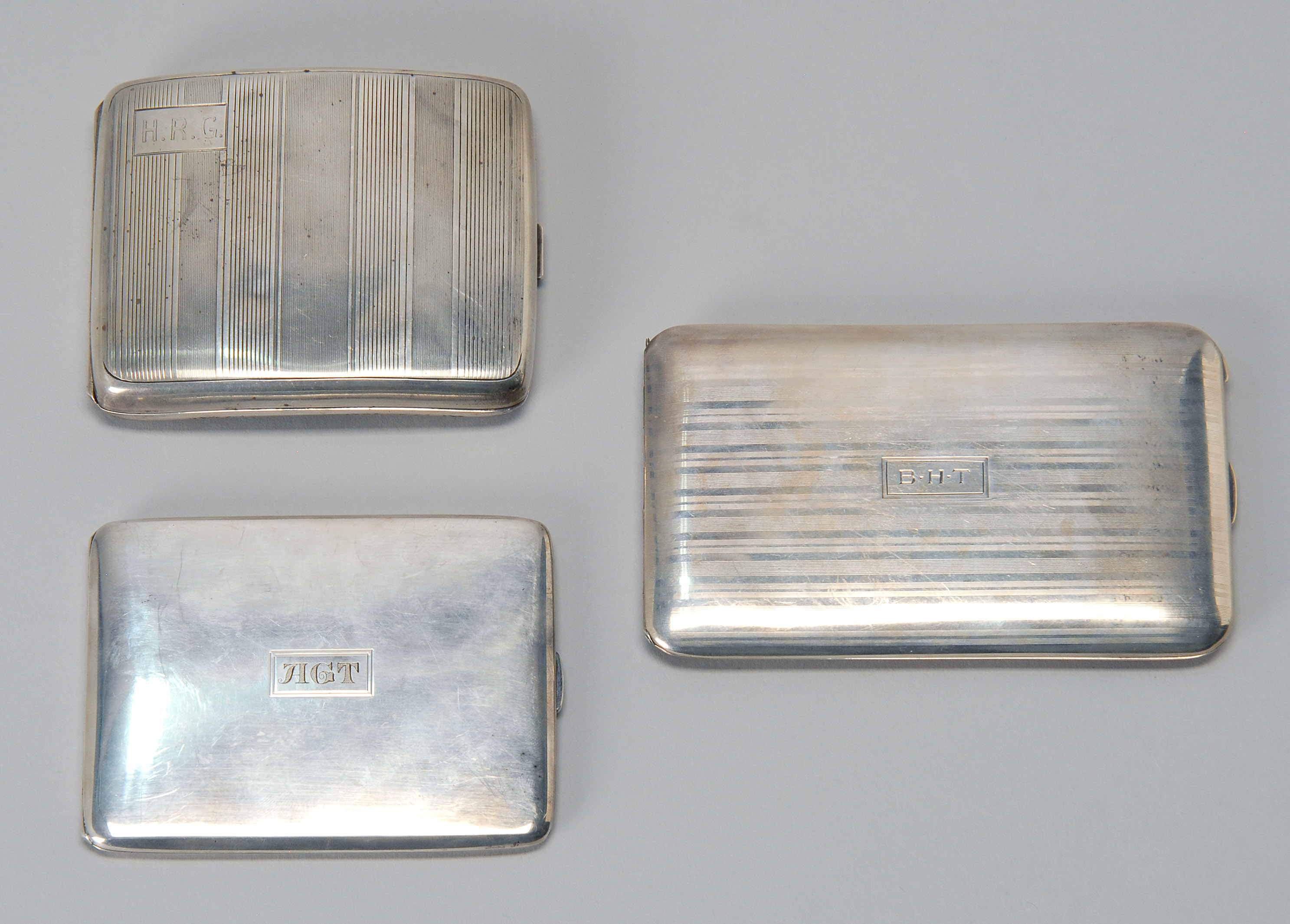 Appraisal: THREE STERLING SILVER CIGARETTE CASES sAll monogrammed By Gorham with