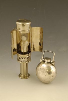 Appraisal: A chrome travel candle lamp of cylindrical form with a