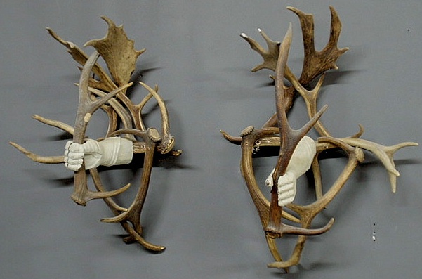 Appraisal: Pair of Black Forest stag horn wall hangings with white