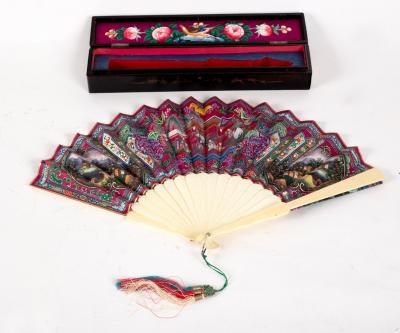 Appraisal: A Chinese painted paper fan decorated figures with ivory sticks