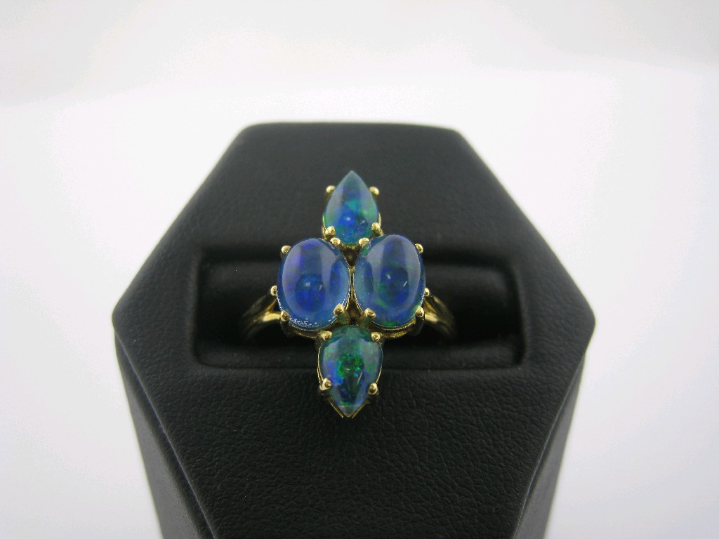 Appraisal: An Opal Triplet Ring claw-set two oval and two pear