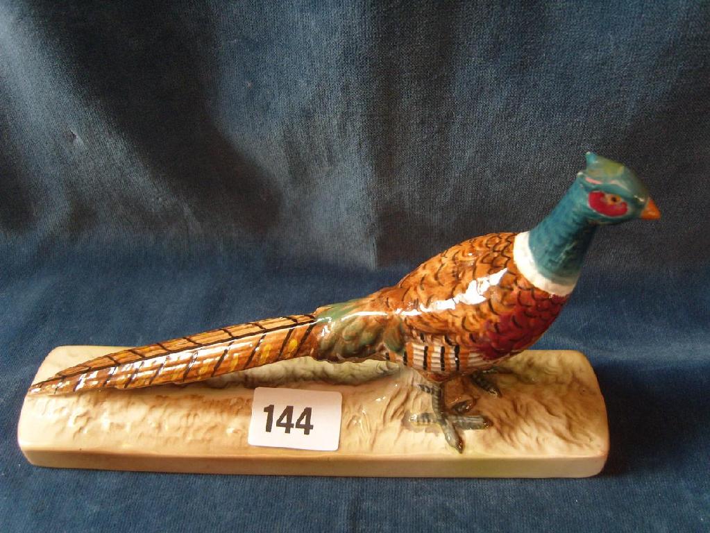 Appraisal: A Beswick model of a standing pheasant raised on elongated