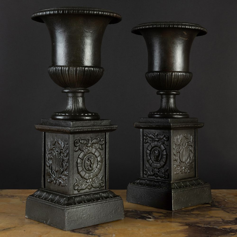 Appraisal: Pair of Black Painted Cast Iron Urns on Pedestals x