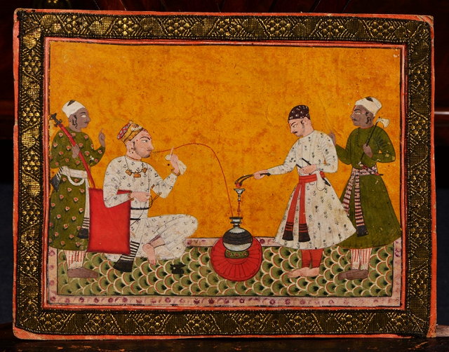 Appraisal: TWO SIMILAR INDIAN MINIATURES painted a nobleman smoking assisted by