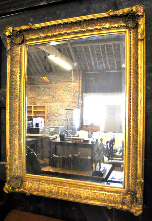 Appraisal: A large Victorian style gilt framed bevel edged mirror with