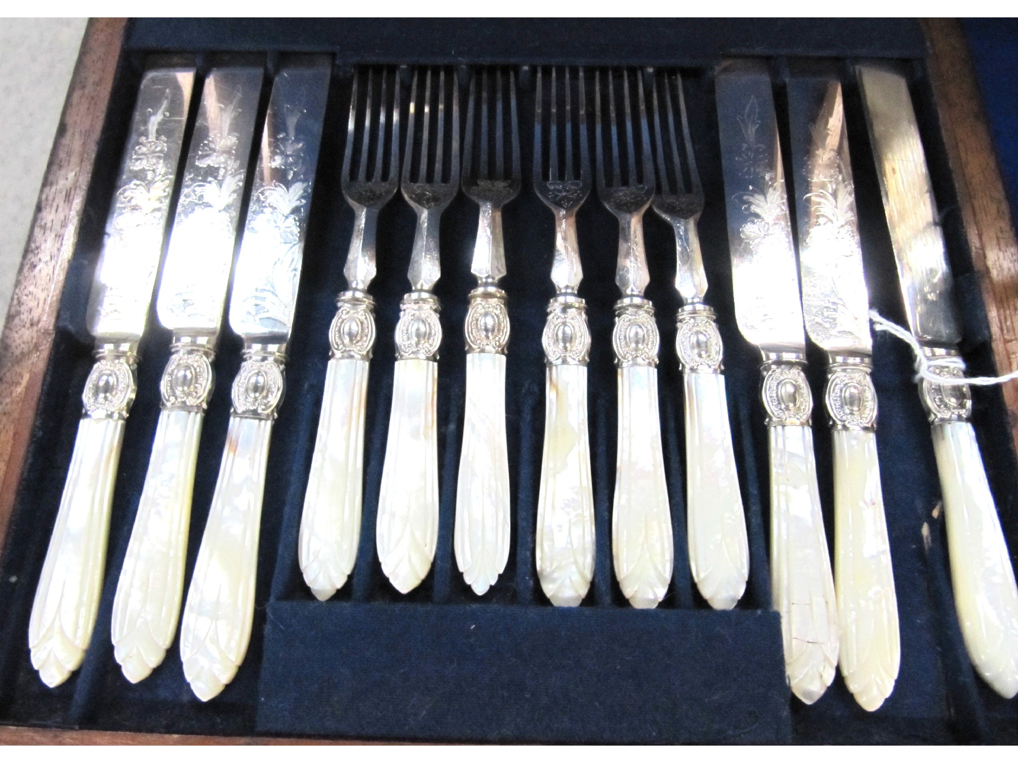 Appraisal: A cased part mother of pearl and EP dessert cutlery