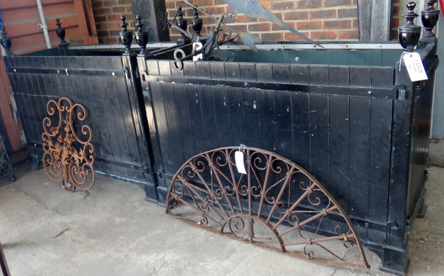 Appraisal: A large pair of iron bound black painted rectangular planters