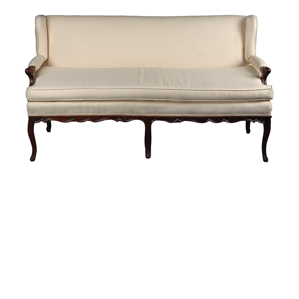 Appraisal: Provincial Louis XV Walnut Canape The rectangular padded backrest and