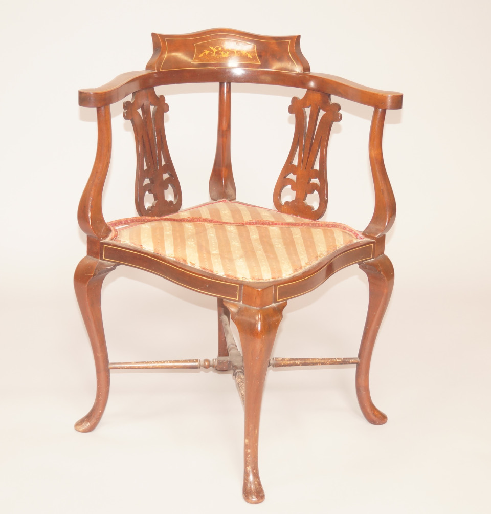 Appraisal: A Georgian mahogany and marquetry corner chair with two pierced