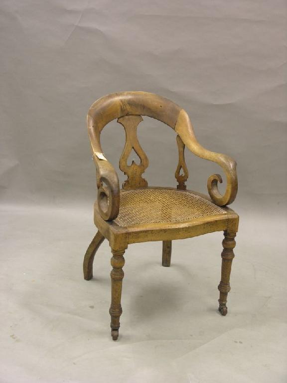 Appraisal: A late Victorian mahogany office armchair with three pierced splats