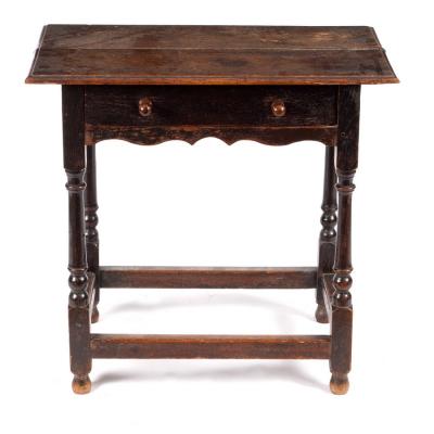 Appraisal: An th Century oak side table the planked top above