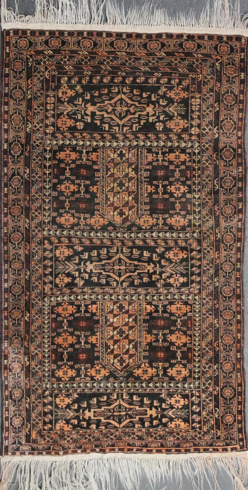 Appraisal: BALUCH PRAYER WOOL RUG having a geometric and floral design