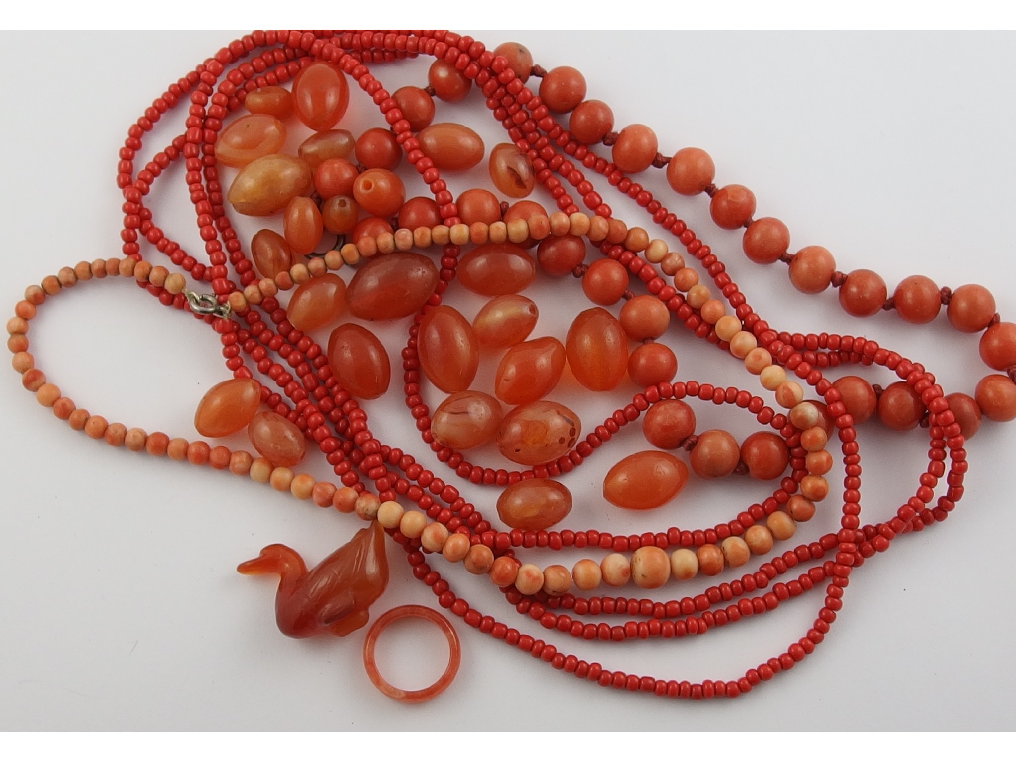 Appraisal: A collection of coral carnelian other gemstone and glass beads