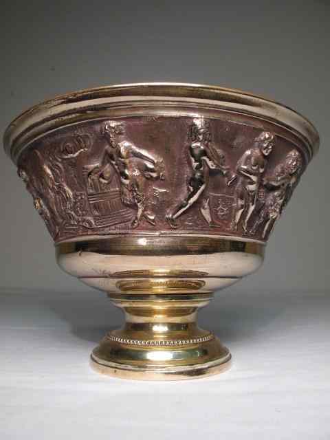 Appraisal: A cast bronze centerpiece cache pot with classical relief design