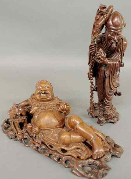 Appraisal: Two Asian carved exotic wood figures one reclining l one