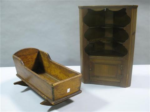 Appraisal: COUNTRY DOLL'S CRADLE MINIATURE CORNER CABINET The cradle of pine