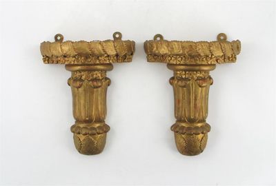 Appraisal: A pair of giltwood wall brackets with leaf and florette