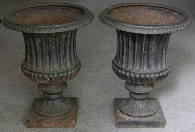 Appraisal: A pair of cast iron Campana shaped vases the flanged