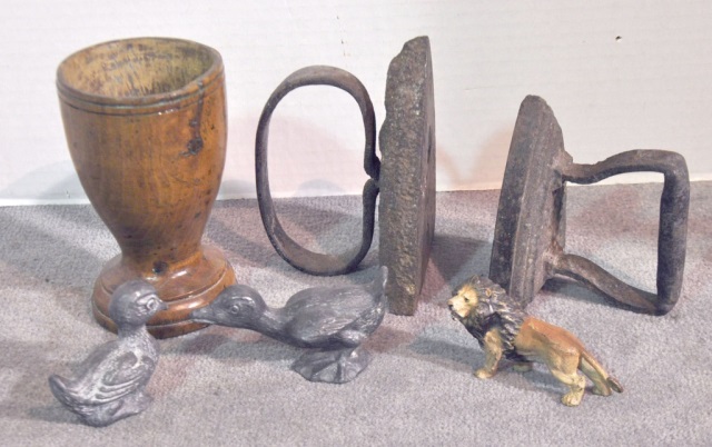 Appraisal: Bx Two Flat IronsThree iron figurines and a treenware mortar