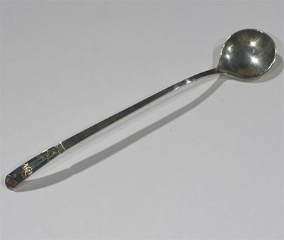 Appraisal: A Bernard Instone enamelled silver spoon the finial enamelled with