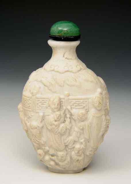 Appraisal: A CHINESE OVOID UNDERGLAZE MOULDED WHITE BISCUIT BOTTLE Immortals in