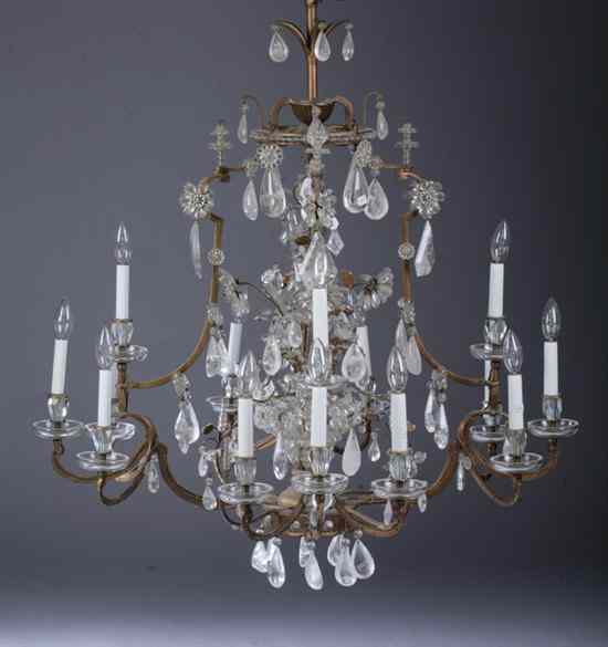 Appraisal: PAIR MAISON BAGU S GILT-METAL AND GLASS -LIGHT CHANDELIERS Circa