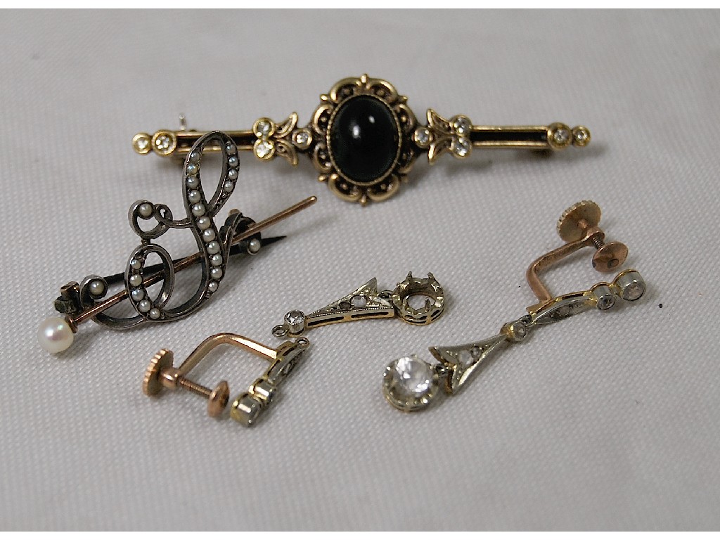 Appraisal: Two brooches one scrollwork initial set pearls one gilt metal