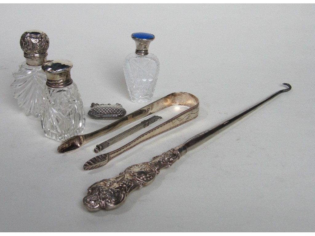 Appraisal: Lot comprising pair of silver tongs silver handled button hook