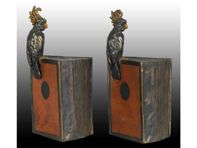 Appraisal: Bronze World Atlas Bookends Description Parrot sitting on top Paper