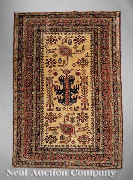 Appraisal: A Caucasian Carpet camel ground blues and reds stylized floral