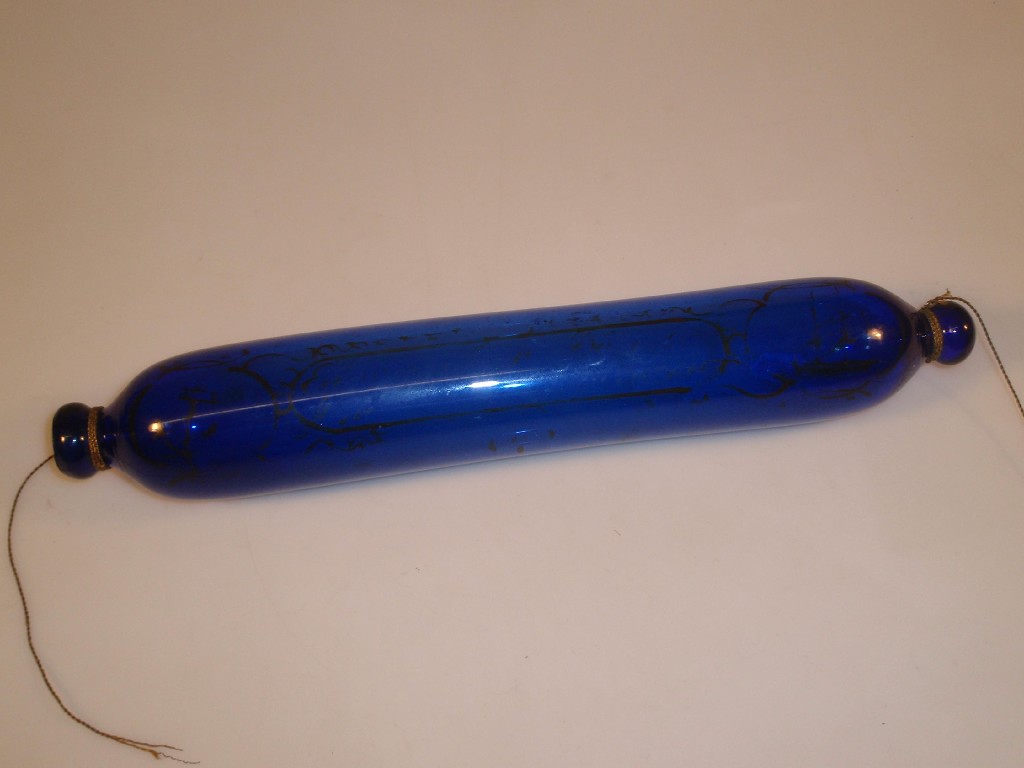 Appraisal: A Victorian blue glass rolling pin with remnants of seafaring