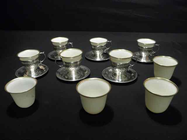 Appraisal: Lenox Sterling silver and porcelain set of demitasse cups saucers