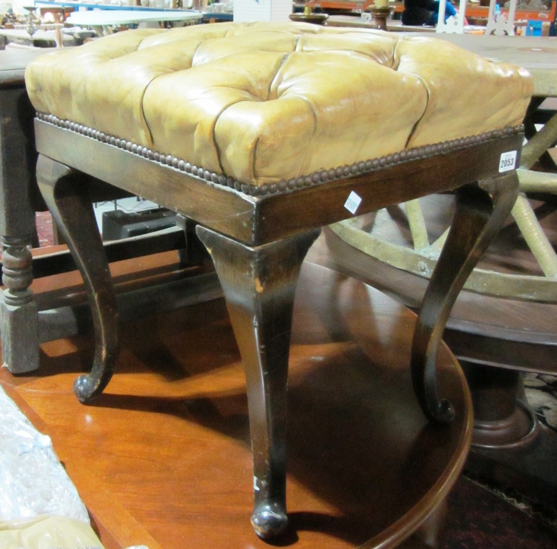 Appraisal: A leather upholstered piano stool