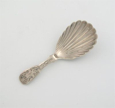 Appraisal: A Victorian caddy spoon engraved fiddle stem shell shaped bowl