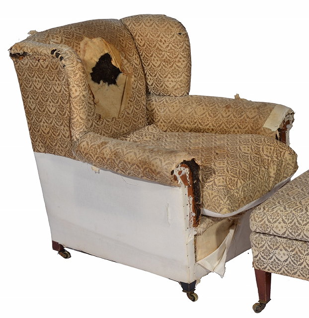 Appraisal: A HOWARD SONS WING ARMCHAIR upholstered in typical patterned material